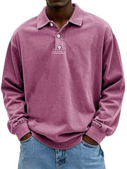 Men's vintage washed long sleeve polo shirt in purple with button detail and cuffed sleeves.