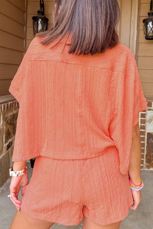 Textured knit drawstring short set in sherbet with short sleeves and elastic waist shorts.