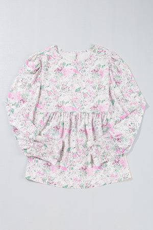 Blush pink floral print blouse with smocked waist and cuffs, round neckline, long sleeves.