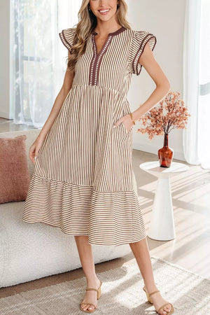 Striped plus size tiered midi dress with V-neck, flutter sleeves, and pockets.