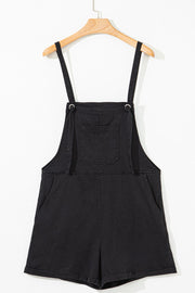 Black denim romper with adjustable straps and chest pocket