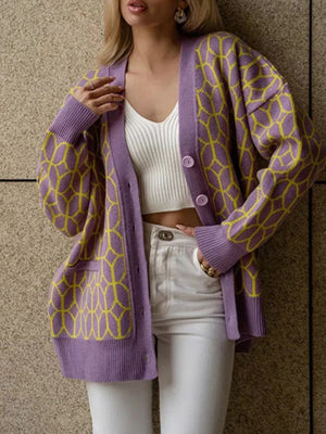 Geometric knit button-up cardigan in dusty pink with yellow pattern, acrylic, V-neck, long sleeves, pockets.