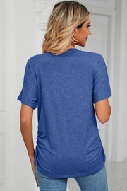 Royal blue tee with short sleeves, V-neck, and side ruching detail.
