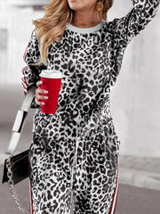 Leopard print plus size two-piece set in white and tan with striped trim.