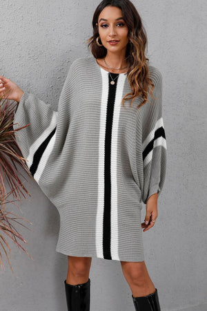 Light gray oversized knit cocoon dress with black and white vertical stripes and sleeve stripes.