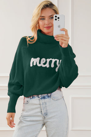 Green acrylic sweater with white "merry" text, turtleneck, and dolman sleeves.