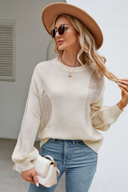 Cream knit sweater with slit detail, crewneck, and balloon sleeves.