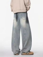 Distressed wide-leg jeans with a belted detail in light wash denim.