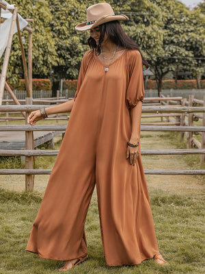 Caramel gathered sleeve wide-leg jumpsuit with V-neck and flowy silhouette.