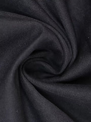 Black midi dress fabric detail with visible texture and subtle sheen.