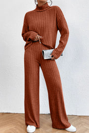 Ribbed knit turtleneck lounge set in rust with wide leg pants and long sleeves.