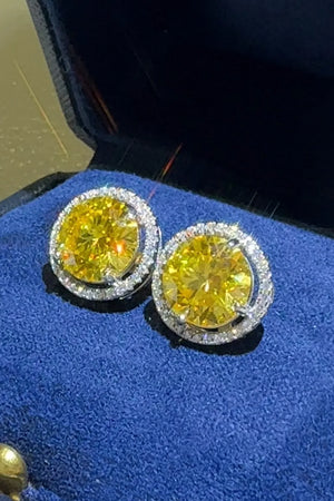 Canary yellow moissanite halo stud earrings with white diamond accents.