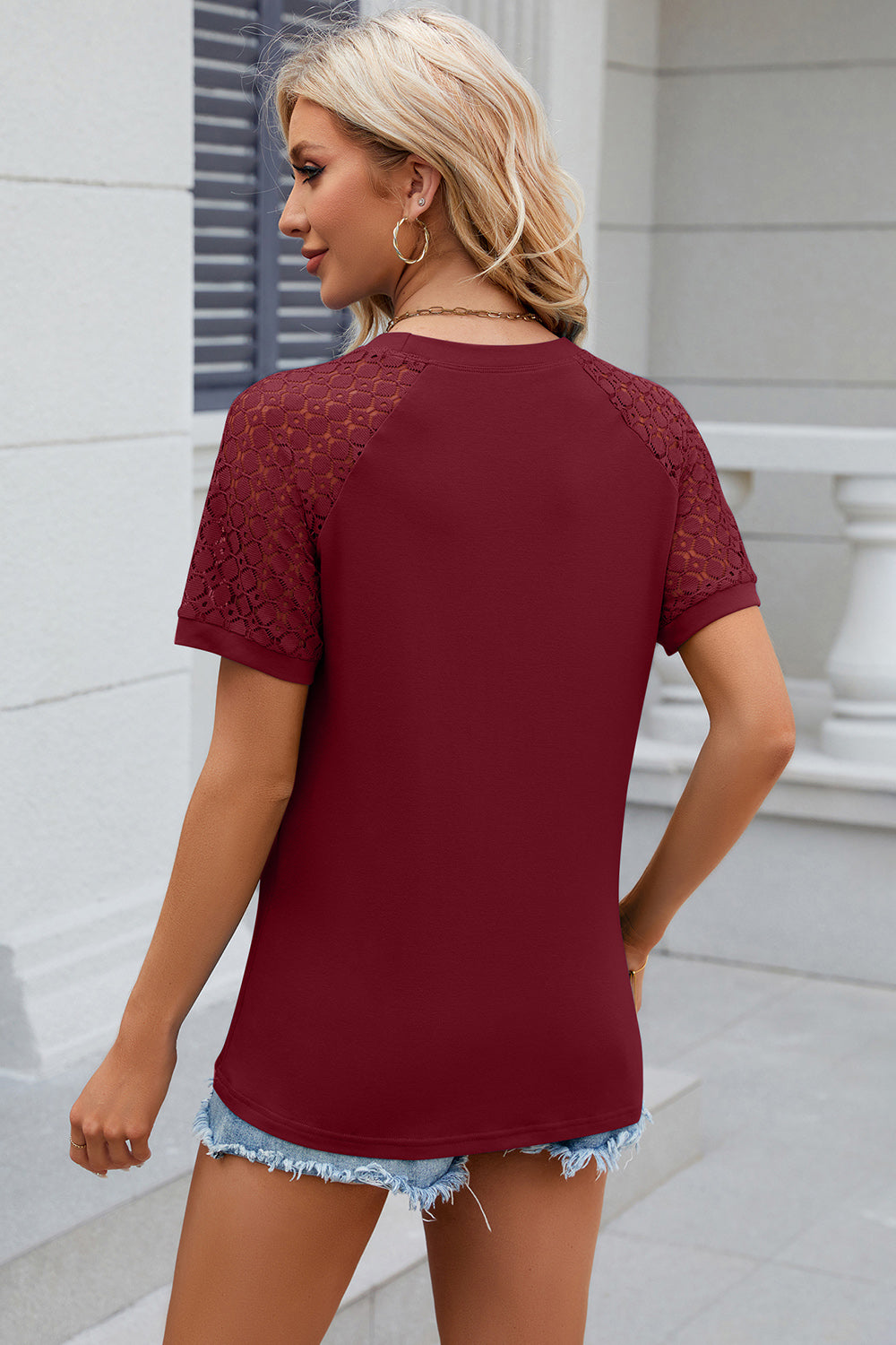 Burgundy lace raglan sleeve ribbed tee with short sleeves and a round neckline.