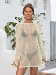 Tan knit cover-up with side slits and boat neck, worn over a bikini.