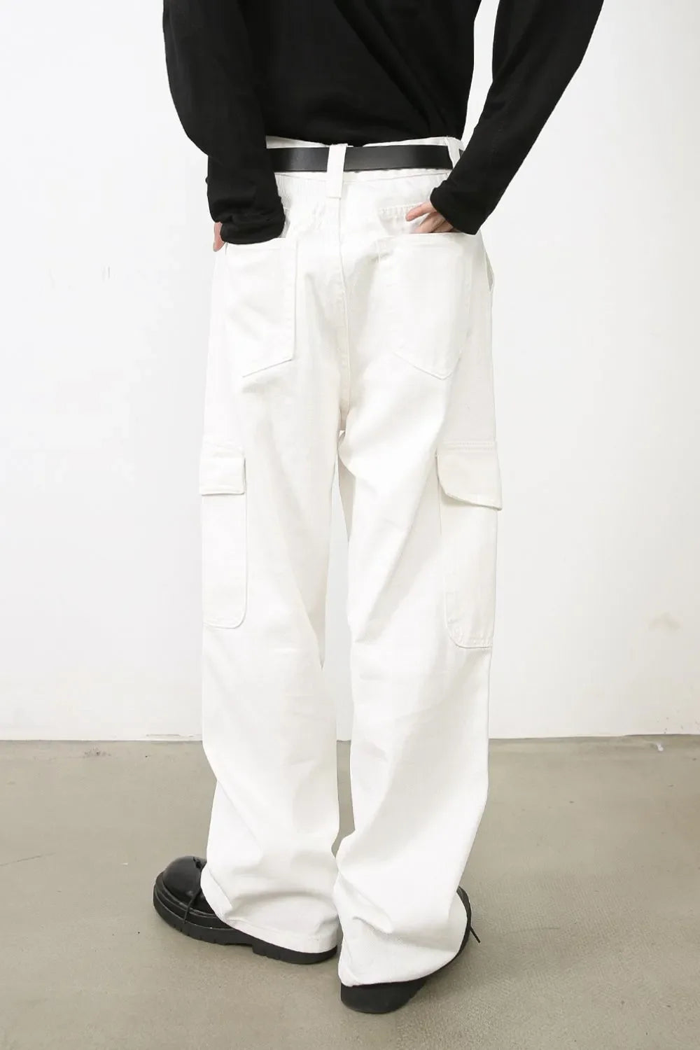 White 100% cotton wide leg cargo pants with multiple pockets.