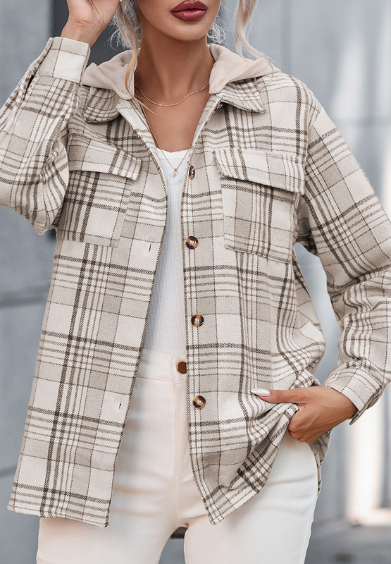 Oversized plaid shacket with attached hoodie, featuring button front and chest pockets.