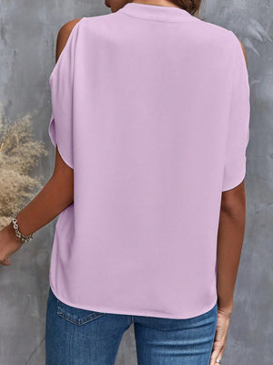 Lilac open-shoulder blouse with keyhole detail, 100% polyester.