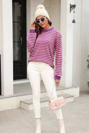 Classic Breton stripe knit crewneck sweater in purple and pink acrylic.