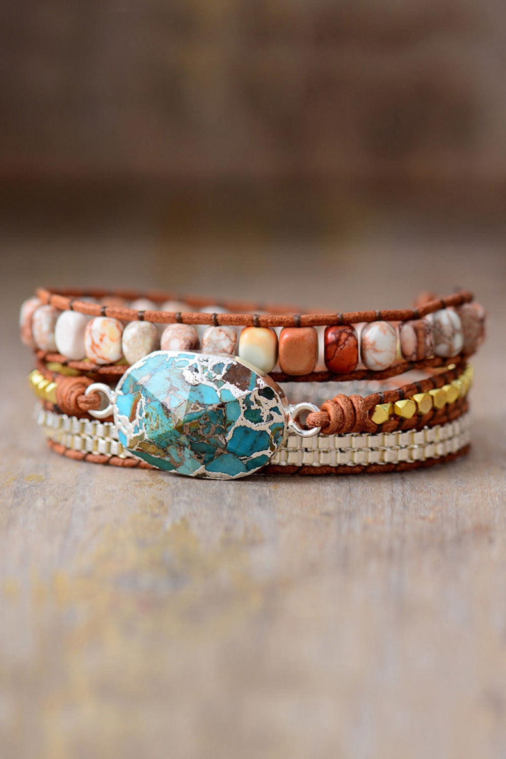 Turquoise and copper wrap bracelet set with natural stone beads and metal accents.