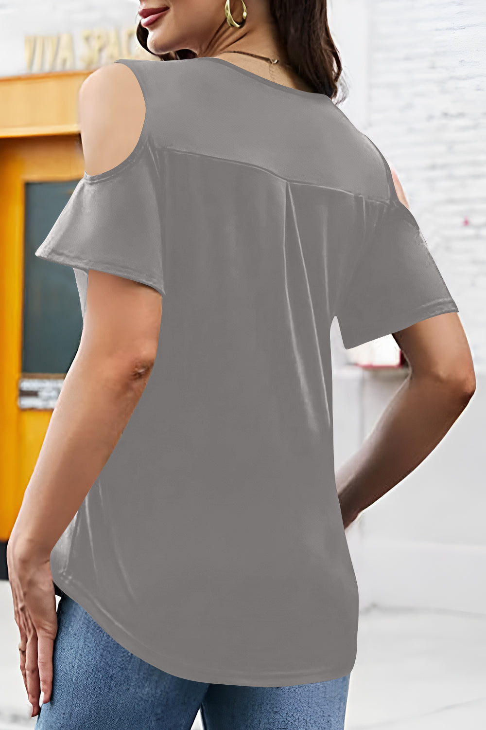 Gray V-neck cold shoulder top with flutter sleeves and a relaxed fit.