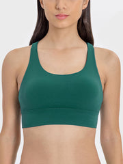 Dark green performance bra with scoop neck and wide band.