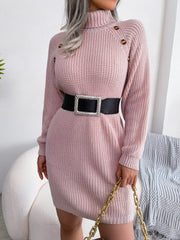 Dusty pink ribbed knit turtleneck sweater dress with shoulder buttons and a jeweled belt.