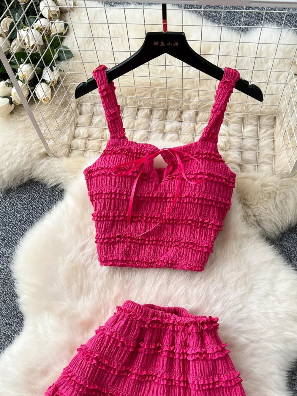 Rose Red ruched crop top and mini skirt set with tie detail.