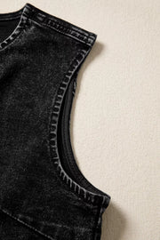 Black denim vest with vintage wash and visible stitching detail on the armhole.