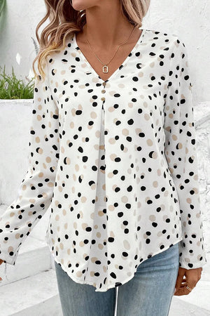 White dotted button-down blouse with V-neck and pleats