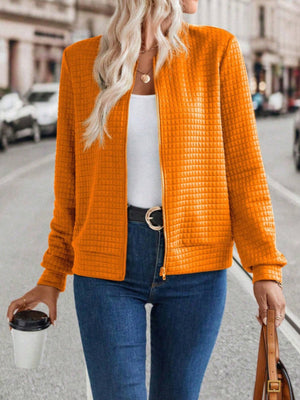 Quilted bomber jacket in Tangerine with zip closure and crew neck.