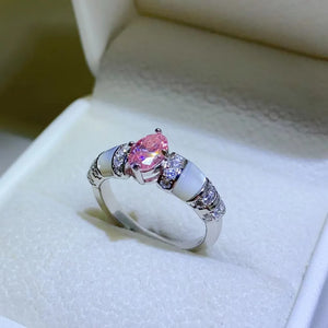 Silver ring with pink oval moissanite and mother-of-pearl accents