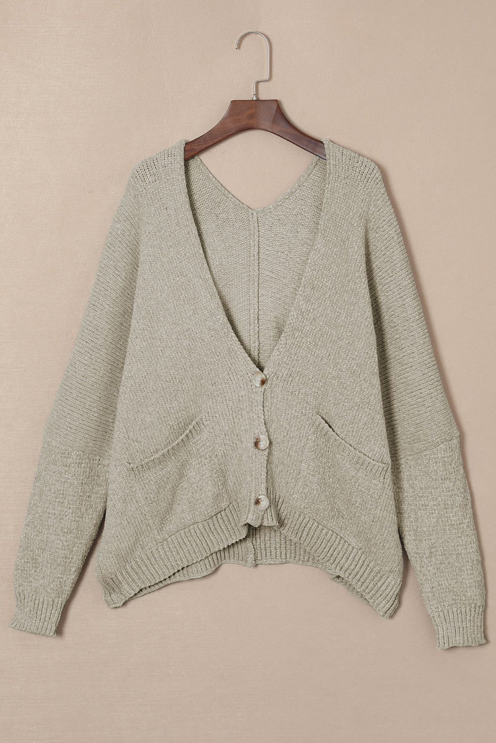 Khaki plush pocket cardigan with deep V-neck and button front.