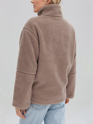 Tan sherpa stand-collar jacket with a textured fleece material and relaxed fit.