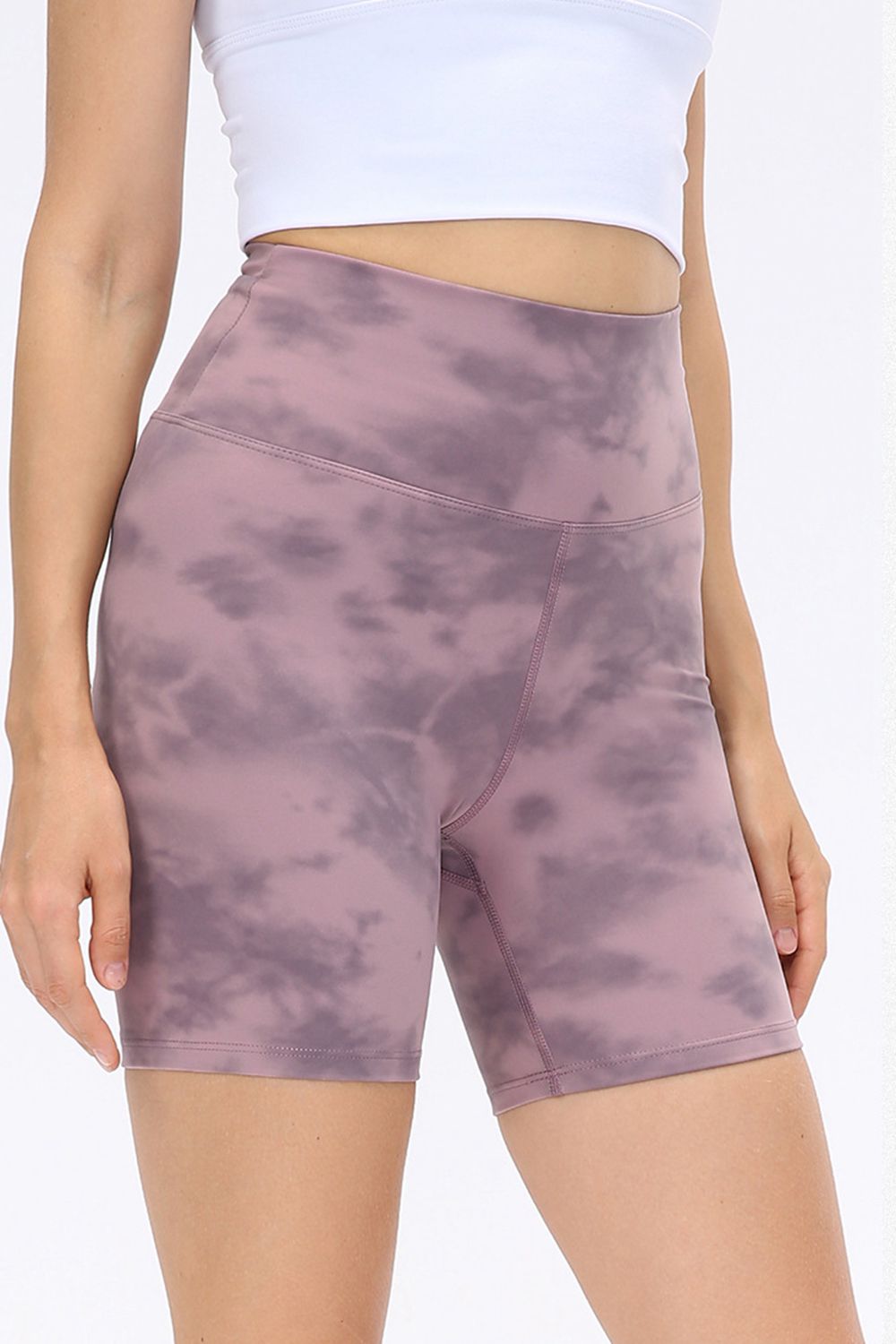 Mauve tie-dye bike shorts with a high waist and sculpted fit.