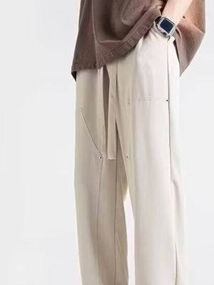 Men's off-white relaxed drawstring sweatpants with seam detail and tie waist.