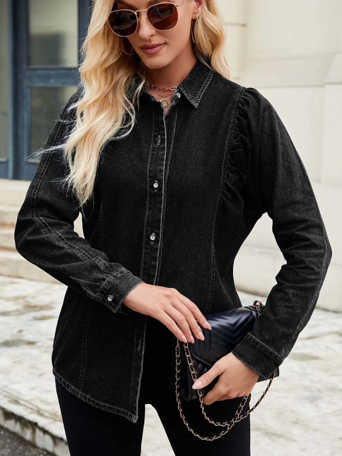 Black denim blouse with ruffled puff sleeves and button front.