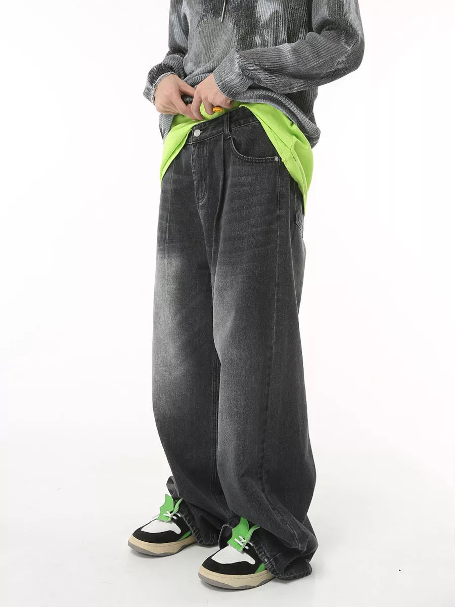 Dark gray wide leg denim jeans with a relaxed fit and visible pockets.
