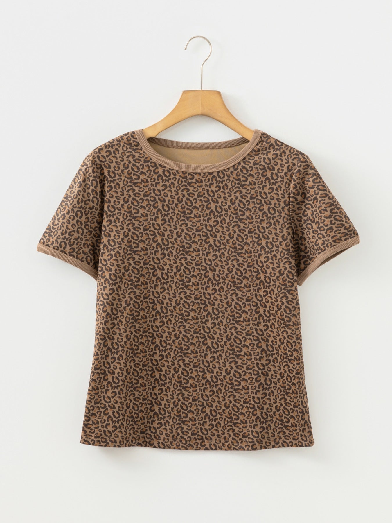 Brown leopard print relaxed fit t-shirt with crew neck and short sleeves.