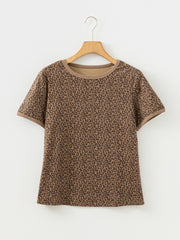 Brown leopard print relaxed fit t-shirt with crew neck and short sleeves.