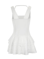 White tiered ruffled mini dress with fitted bodice and square neckline.