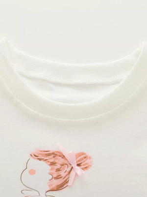 White cotton tee with ruffled sleeve detail and a cute graphic of a girl with a pink bow.
