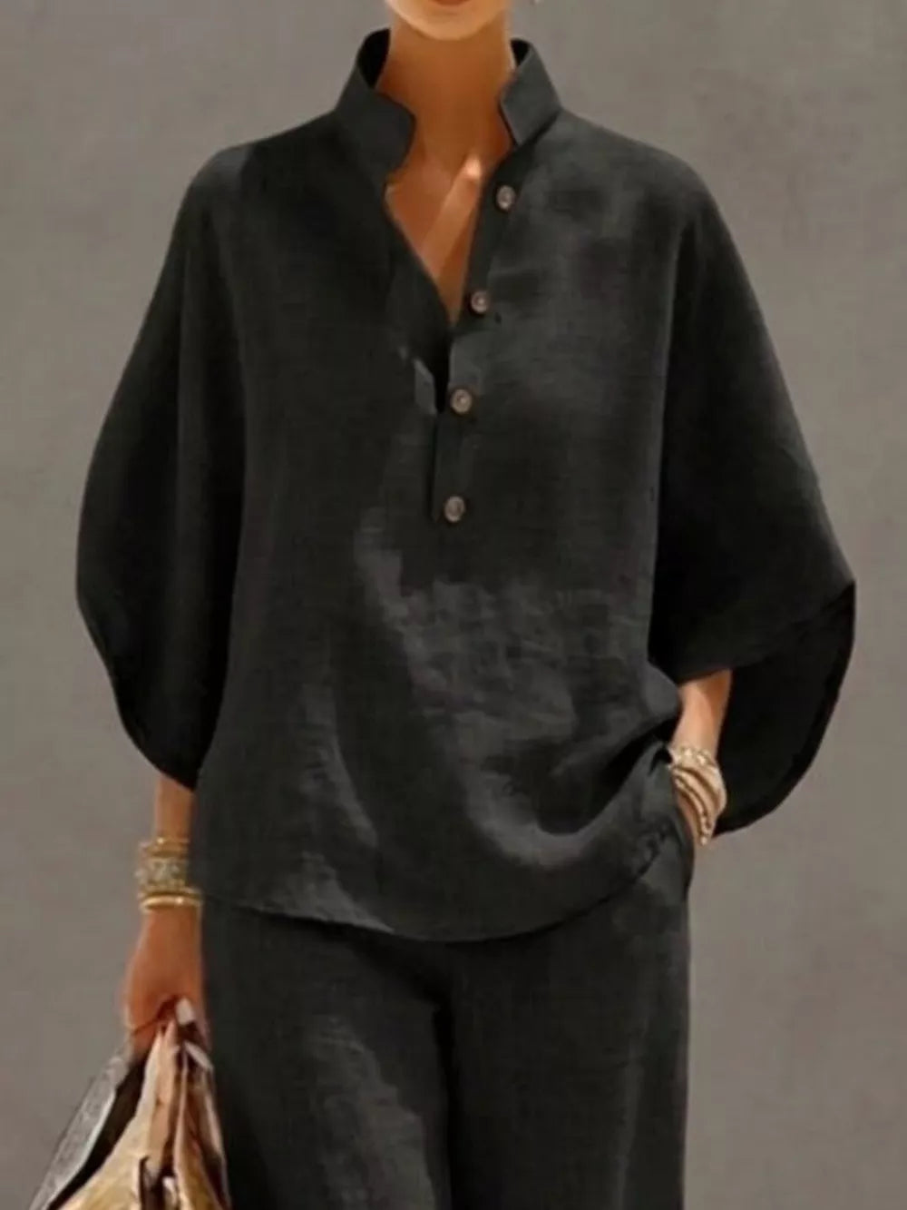 Black button-down loungewear set with a stand collar and wide sleeves.
