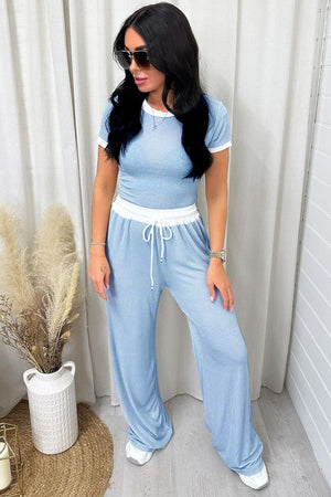 Blue ribbed lounge set with contrast trim t-shirt and wide-leg pants.