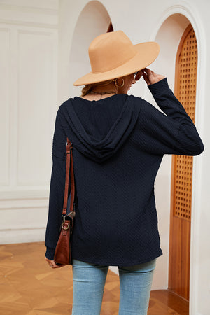Navy textured henley hoodie with drop shoulder and hood, shown from back.