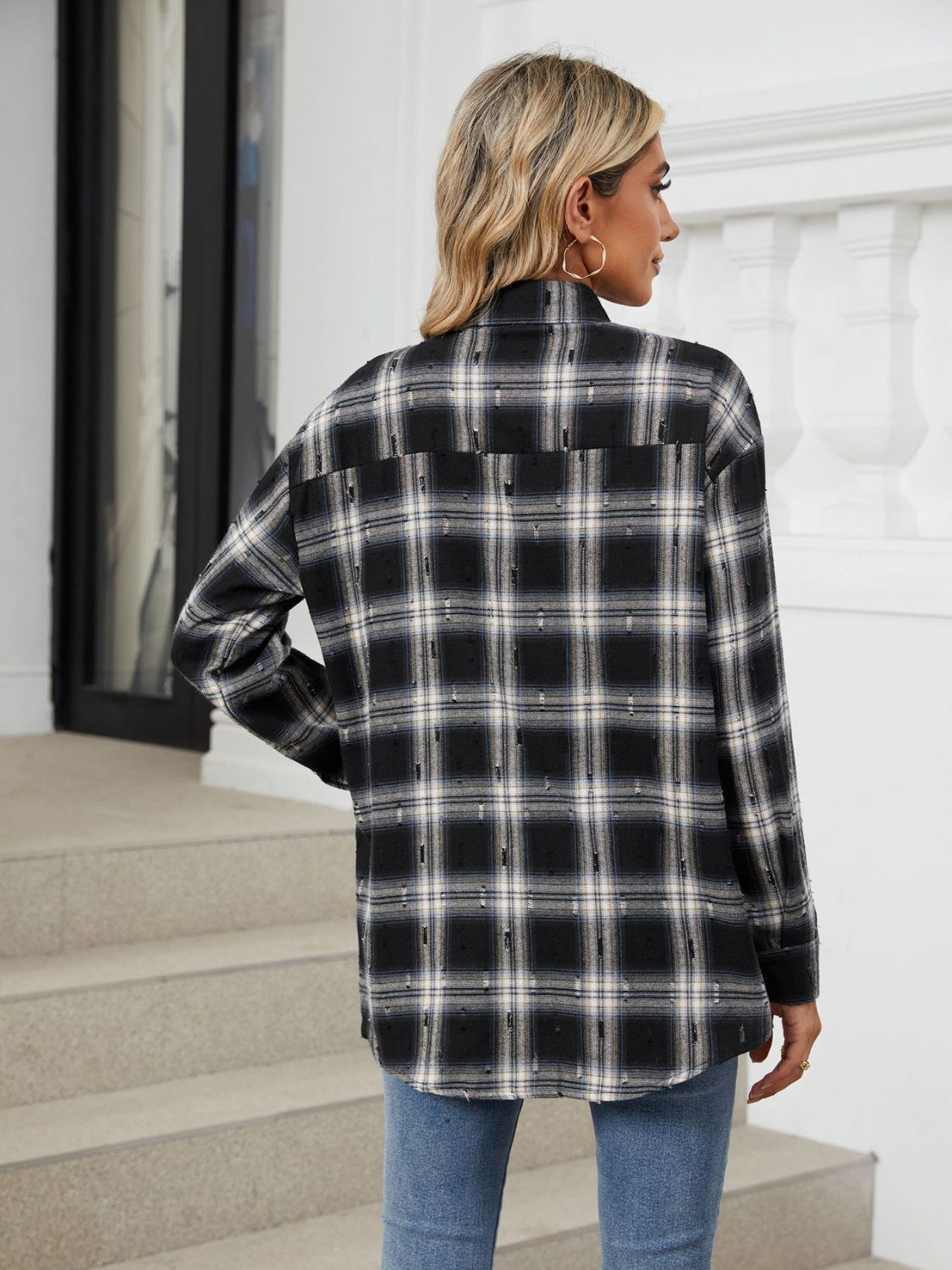 Black plaid relaxed fit overshirt with distressed details.