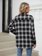 Black plaid relaxed fit overshirt with distressed details.