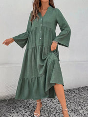Green tiered ruffle hem v-neck dress with button front and bell sleeves.