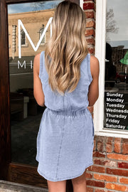 Light blue denim mini dress with elastic waist and sleeveless tank top style.