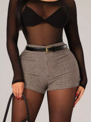 Chic houndstooth high-waisted shorts with a black belt.