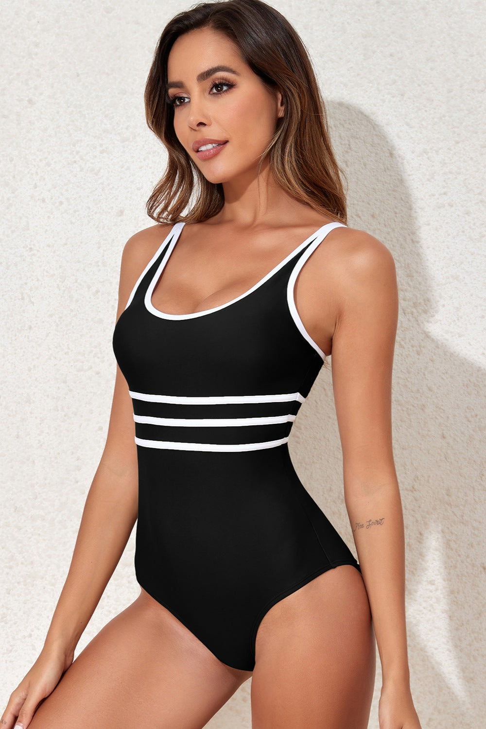 Black one-piece swimsuit with white stripe trim and scoop neckline.